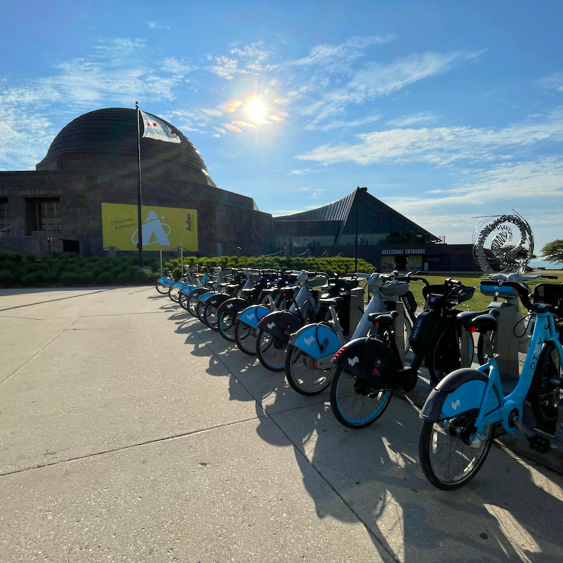 Divvy bike station located in front of the Adler Planetarium in Chicago, IL.