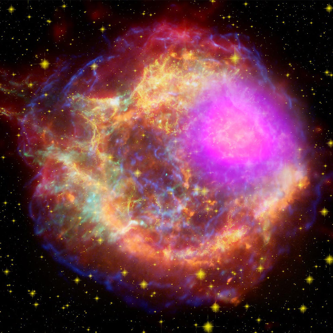 This composite image shows the Cassiopeia A supernova remnant across the light spectrum: Gamma rays (magenta), X-rays (blue, green), visible light (yellow), infrared (red), and radio (orange). Image credit: NASA/DOE/Fermi LAT Collaboration, CXC/SAO/JPL-Caltech/Steward/O. Krause et al., and NRAO/AUI
