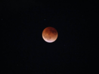 The full Moon is covered by a dark red shadow during a total lunar eclipse