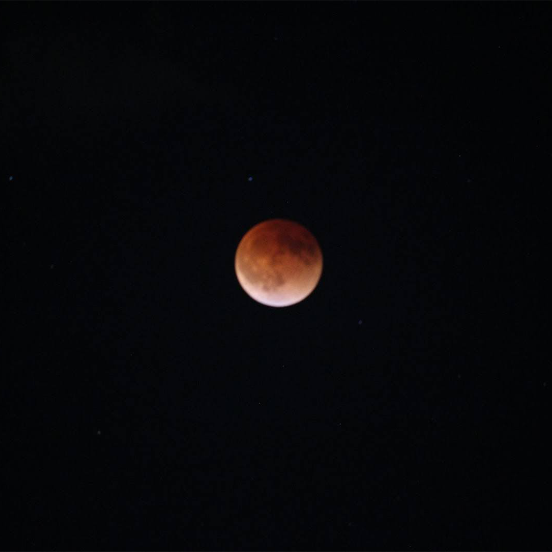 The full Moon is covered by a dark red shadow during a total lunar eclipse